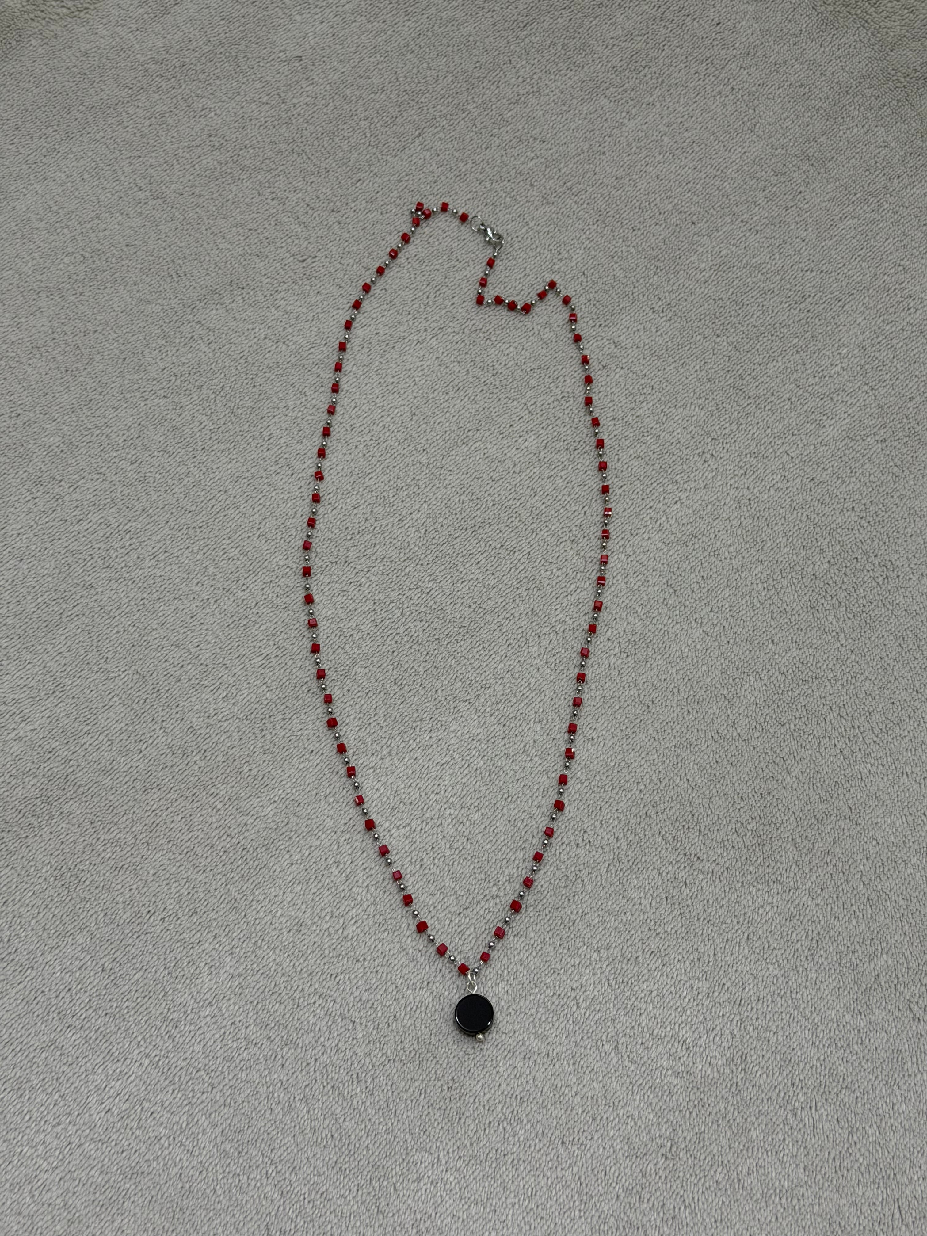 Stainless steel necklace with red beads