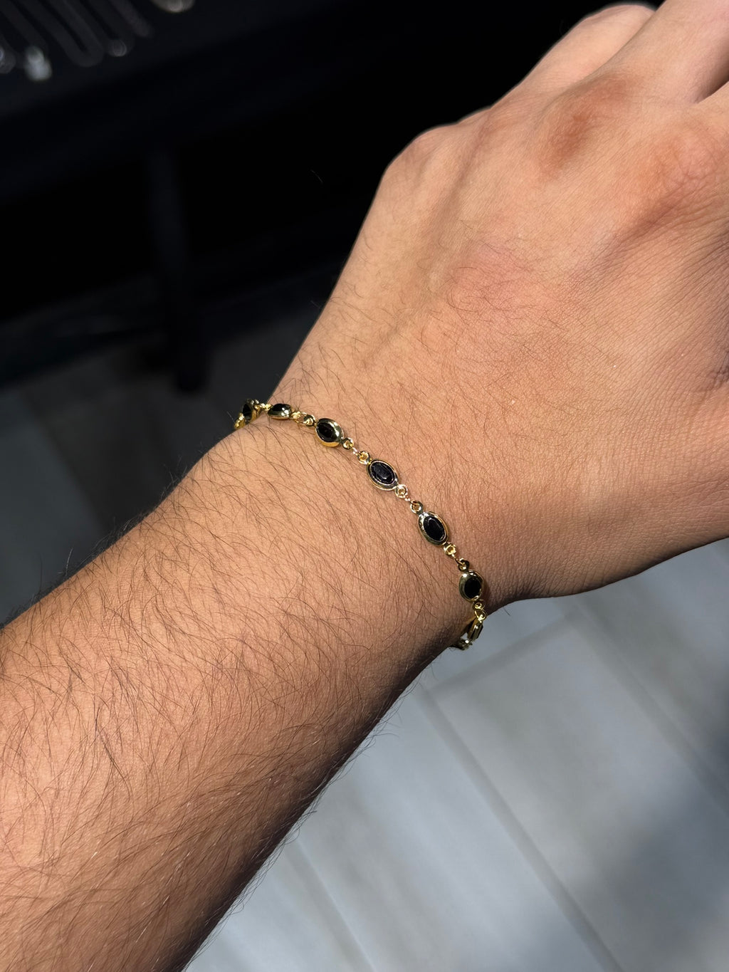 8. Black Oval Gold Bracelet