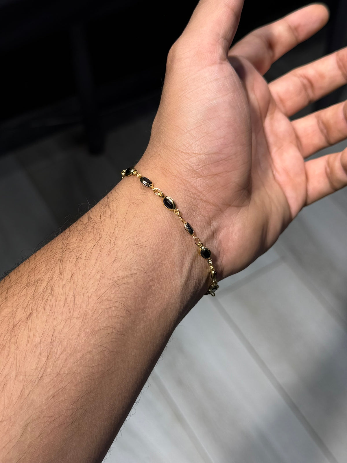 8. Black Oval Gold Bracelet
